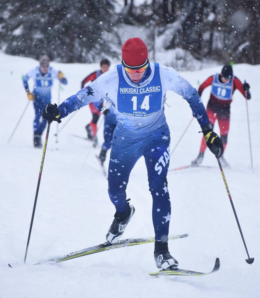 Soldotnas Jeremy Kupferschmid powers his way up a hill early in Saturdays boys relay at the Kenai Peninsula Borough nordic ski meet at the Tsalteshi Trails in Soldotna. (Photo by Joey Klecka/Peninsula Clarion)