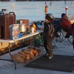 Some youngsters eye the hot chocolate and other offerings at a free ice skating party hosted by Rotary Club of Homer-Kachemak Bay, McDonalds and the City of Homer on Friday, Feb. 15, 2019 at Ben Walters Park and Beluga Lake in Homer, Alaska. (Photo by Megan Pacer/Homer News)