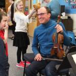 Daniel Perry answers questions from students after a concert Friday, Feb. 15, 2019 at Paul Banks Elementary School in Homer, Alaska. (Photo by Megan Pacer/Homer News)