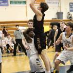 Nathan Ivanoff of Grace Christian School takes a shot at the Homer basket during a Friday, Feb. 22, 2019 game in Homer, Alaska. (Photo by Megan Pacer/Homer News)