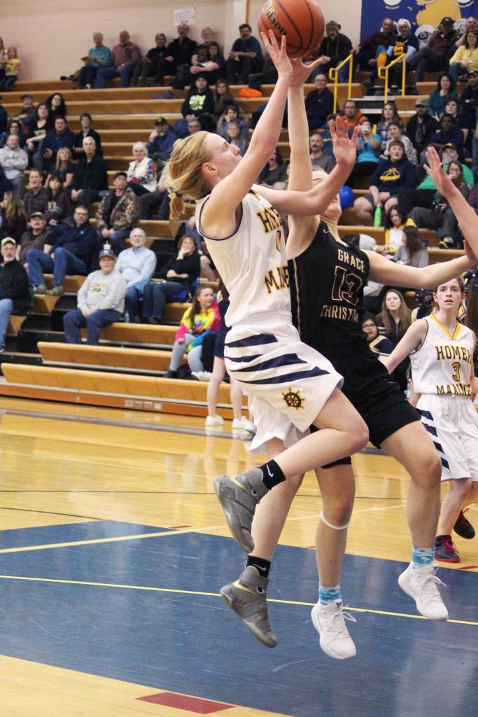 Homers Kelli Bishop takes a shot on the Grace Christian School basket during a Friday, Feb. 22, 2019 game in Homer, Alaska. (Photo by Megan Pacer/Homer News)