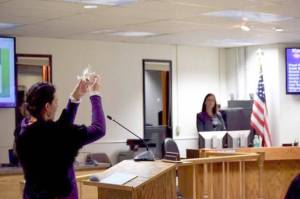 Community member Kalliste Edeen offers an invocation at the Jan. 8 Kenai Peninsula Borough Assembly meeting. (Photo by Brian Mazurek/Peninsula Clarion)