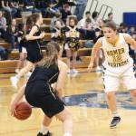 Homers Rylee Doughty tries to block Tessa Binder from Grace Christian School during a Friday, Feb. 22, 2019 game in Homer, Alaska. Grace is one of three private school teams in Region 3A basketball. (Photo by Megan Pacer/Homer News)