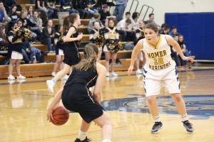 Homers Rylee Doughty tries to block Tessa Binder from Grace Christian School during a Friday, Feb. 22, 2019 game in Homer, Alaska. Grace is one of three private school teams in Region 3A basketball. (Photo by Megan Pacer/Homer News)