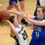 Cook Inlet Academys Addie Nelson pressures Nikolaevsks Krystyana Kalugin on Friday during the Peninsula Conference girls championship at Cook Inlet Academy in Soldotna. (Photo by Jeff Helminiak/Peninsula Clarion)