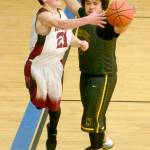 Nikolaevsks Justin Trail saves the ball in front of Ninilchiks George Nelson on Friday during the Peninsula Conference boys championship game at Cook Inlet Academy in Soldotna. (Photo by Jeff Helminiak/Peninsula Clarion)
