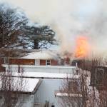 A fire blazes in the old Bay View Inn on the Sterling Highway near the Baycrest Overlook on Thursday, March 7, 2019 in Homer, Alaska. (Photo by Megan Pacer)
