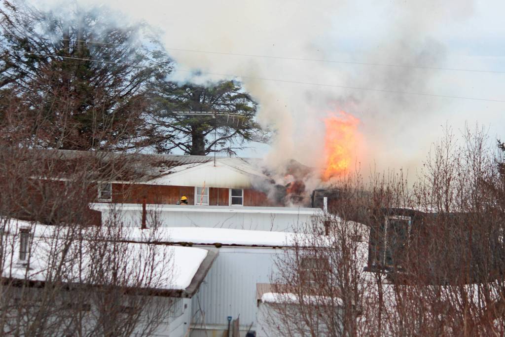 A fire blazes in the old Bay View Inn on the Sterling Highway near the Baycrest Overlook on Thursday, March 7, 2019 in Homer, Alaska. (Photo by Megan Pacer)