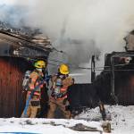 Firefighters douse a blaze that engulfed the old Bay View Inn on the Sterling Highway near the Baycrest Overlook on Thursday, March 7, 2019 in Homer, Alaska. (Photo by Megan Pacer/Homer News)