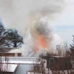 A fire at the old Bay View Inn near the Baycrest Overlook on the Sterling Highway sends a plume of smoke into the air Thursday, March 7, 2019 in Homer, Alaska. (Photo by Megan Pacer/Homer News)