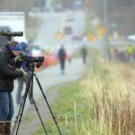 Birders line the bike path on the Homer Spit while looking for shorebirds in Mud Bay in Ma 2018, for the Kachemak Bay Shorebird Festival. (Photo by Michael Armstrong/Homer News)