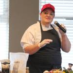 Mandy Dixon, owner of La Baleine, speaks during a cooking demo during the Alaska Food Festival on Saturday, March 9, 2019 at Lands End Resort in Homer, Alaska. She and her mother, Kirseten, who owns Tutka Bay Lodge, spoke about their travels to other countries and how that inspires their cooking in Alaska. (Photo by Megan Pacer/Homer News)