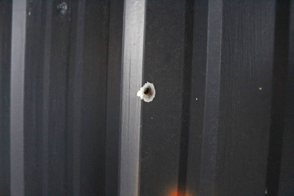 A bullet hole penetrates one of the outside walls of Wasabis Bistro from a vandalism incident a few years ago, shown here on Thursday, March 21, 2019 just outside of Homer, Alaska. This is one of several incidents of racist attacks agains the owners of the bistro. (Photo by Megan Pacer/Homer News)