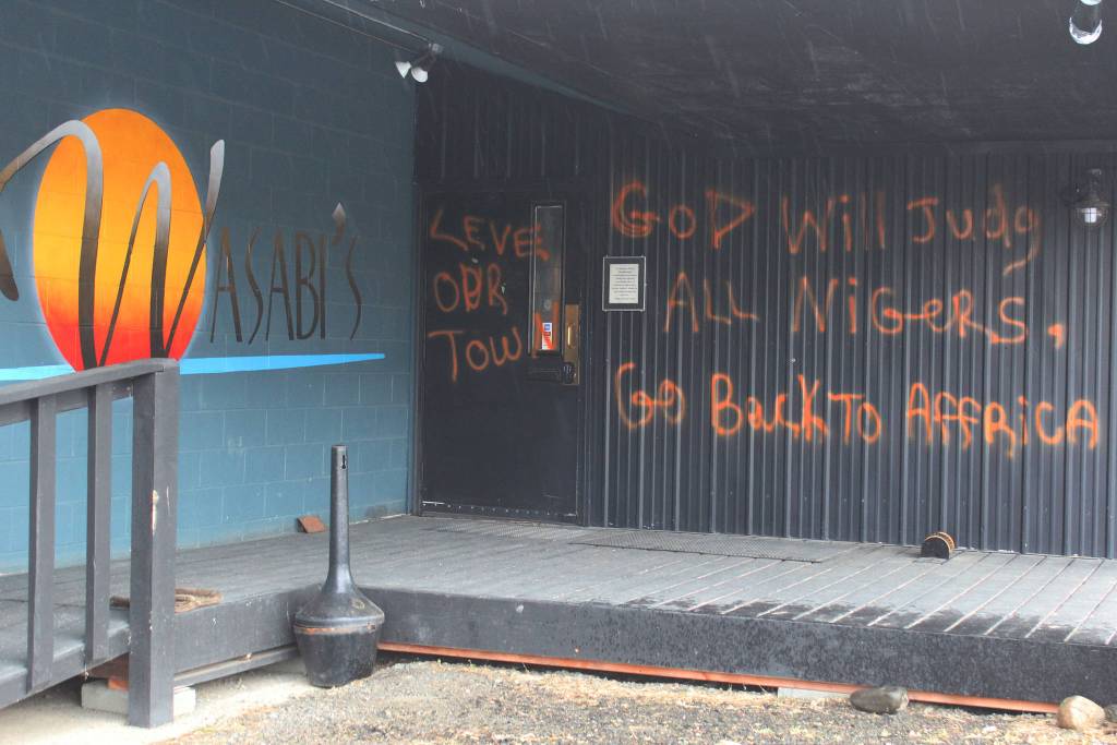 Racist messages are spray painted onto a wall at Wasabis Bistro, shown here Thursday, March 21, 2019 just outside of Homer, Alaska. (Photo by Megan Pacer/Homer News)