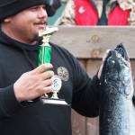 William Freeman accepts his third place award for his 24.56-pound king salmon Saturday, March 23, 2019 at the Homer Winter King Salmon Tournament in Homer, Alaska. (Photo by Megan Pacer/Homer News)