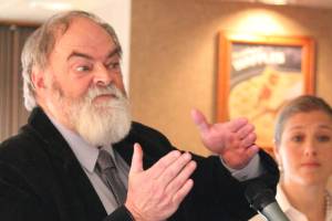 Mayor Ken Castner addresses a crowd of people at a Tuesday, March 26, 2019 Homer Chamber of Commerce meeting during a State of the City address at the Best Western Bidarka Inn in Homer, Alaska. (Photo by Megan Pacer/Homer News)