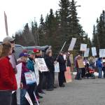 Protesters stand outside the Cannery Lodge in Kenai, Alaska, ahead of Gov. Mike Dunleavys presentation about his proposed budget on March 26, 2019. (Photo by Victoria Petersen/Peninsula Clarion)