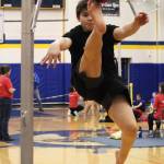 William Wilson, 13, performs the one-foot high kick Saturday, March 30, 2019 during the Kachemak Bay Traditional Games held at Homer High School in Homer, Alaska. (Photo by Megan Pacer/Homer News)