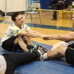 Brothers Elias Moonin (left) and Tristan Moonin (right) compete in the Eskimo Stick Pull during the Kachemak Bay Traditional Games invitational Saturday, March 30, 2019 at Homer High School in Homer, Alaska. (Photo by Megan Pacer/Homer News)