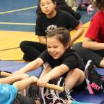 Sonya Ivanoff, 8, participates in the Eskimo Stick Pull during the Kachemak Bay Traditional Games invitational Saturday, March 30, 2019 at Homer High School in Homer, Alaska. (Photo by Megan Pacer/Homer News)