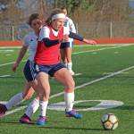 Homers Jessica Sonnen fights to keep the ball from Soldotna High School possession during a Tuesday, April 9, 2019 game in Homer, Alaska. The teams tied 3-3. (Photo by Megan Pacer/Homer News)