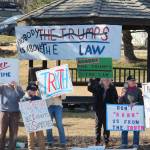 Local demonstrators stand at WKFL Park on Thursday, April 4, 2019 in Homer, Alaska, joining protests done nationally to prompt the release of special counsel Robert Muellers report of his investigation into Russian interference in the 2016 United States presidential election. (Photo by Megan Pacer/Homer News)