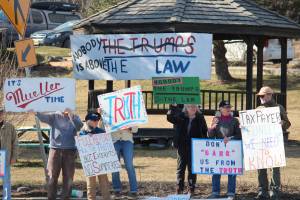 Local demonstrators stand at WKFL Park on Thursday, April 4, 2019 in Homer, Alaska, joining protests done nationally to prompt the release of special counsel Robert Muellers report of his investigation into Russian interference in the 2016 United States presidential election. (Photo by Megan Pacer/Homer News)