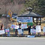 Local demonstrators stand at WKFL Park on Thursday, April 4, 2019 in Homer, Alaska, joining protests done nationally to prompt the release of special counsel Robert Muellers report of his investigation into Russian interference in the 2016 United States presidential election. (Photo by Megan Pacer/Homer News)