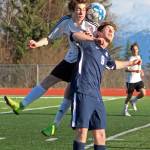 Kenais Francisco Garmen Munarriz jumps for the ball along with Homers Avram Salzmann during a Tuesday, April 16, 2019 game at Homer High School in Homer, Alaska. (Photo by Megan Pacer/Homer News)