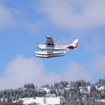 A floatplane takes off from Beluga Lake on Monday afternoon, April 22, 2019, in Homer, Alaska. Although a snow storm brought a taste of winter back to Homer after a deceptive spring, the lake remained open enough for float planes to start using it. (Photo by Michael Armstrong/Homer News)