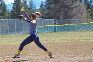 Pitcher Annalynn Brown winds up to send a ball over the plate during the Homer Mariners Saturday, April 27, 2019, game against the Kodiak Bears at Jack Gist Park in Homer, Alaska. (Photo by McKibben Jackinsky)