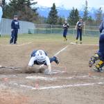 A SoHi softball player takes a dive for the plate in a game against the Homer High School Mariners on Tuesday, April 30, 2019, against Soldotna High School at Jack Gist Park in Homer, Alaska. (Photo by Michael Armstrong/Homer News)