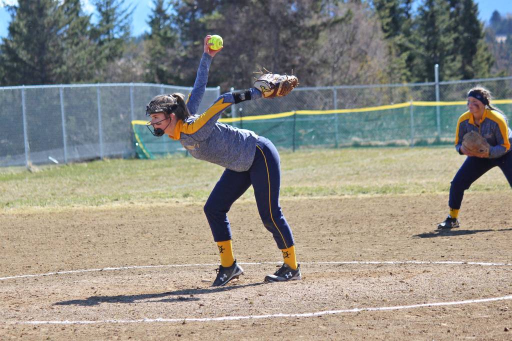 Pitcher Annalynn Brown winds up to send a ball over the plate during the Homer Mariners Saturday, April 27, 2019, game against the Kodiak Bears at Jack Gist Park in Homer, Alaska. (Photo by McKibben Jackinsky)