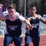 Soldotna junior Ben Booth (right) hands off sophomore teammate Eli Cravens in the boys 800-meter relay Saturday afternoon at the SoHi Region III Preview Invite at Justin Maile Field in Soldotna. (Photo by Joey Klecka/Peninsula Clarion)