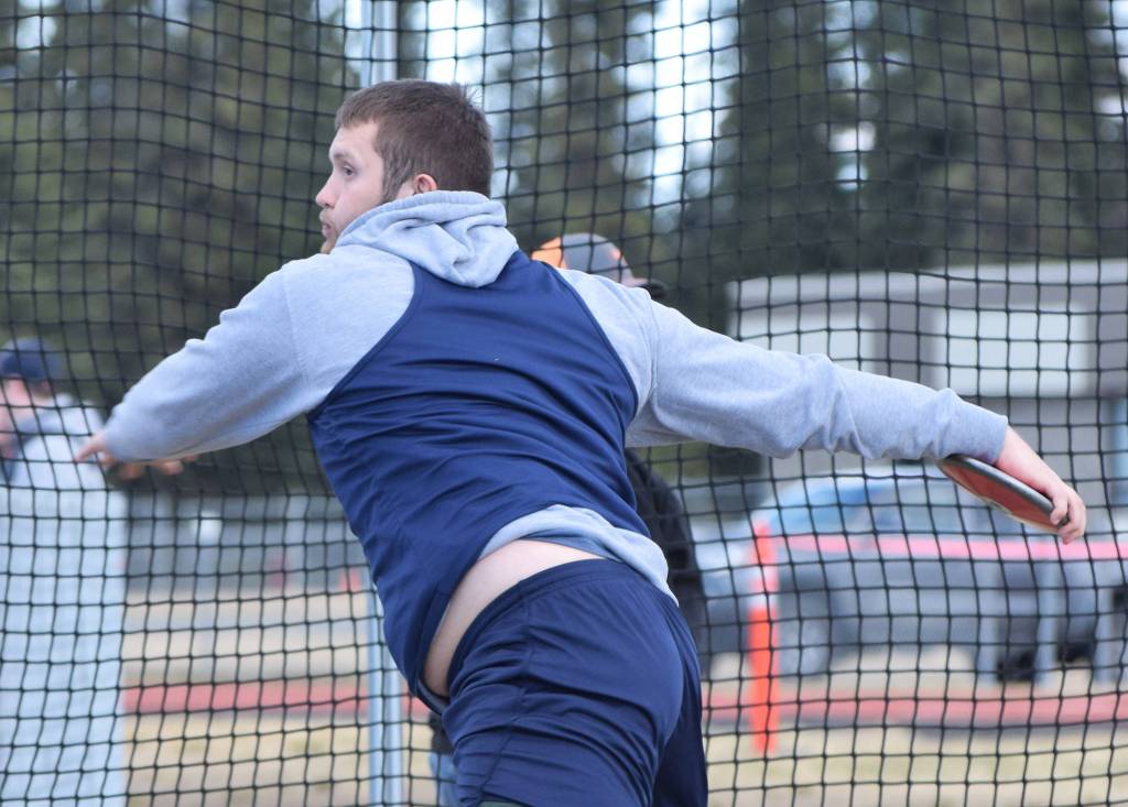 Soldotnas Levi Benner unwinds for a throw in the boys discus Saturday at the Kenai Invitational track meet at Kenai Central High School. (Photo by Joey Klecka/Peninsula Clarion)