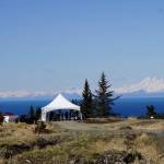 Visitors walk toward the site of the Storyknife Writers Retreat in Homer, Alaska, last Saturday, May 4, 2019, at groundbreaking ceremonies for the main house and cabins that will house visiting women writers. (Photo by Michael Armstrong/Homer News)