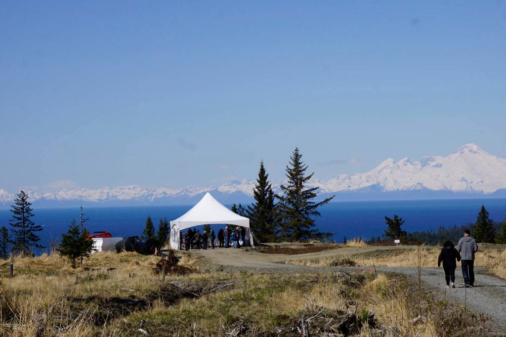 Visitors walk toward the site of the Storyknife Writers Retreat in Homer, Alaska, last Saturday, May 4, 2019, at groundbreaking ceremonies for the main house and cabins that will house visiting women writers. (Photo by Michael Armstrong/Homer News)