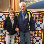 Veteran Robert Haynes, right, with his wife, Anne, receives a Quilt of Honor made by the Faith Friday Friends of Faith Lutheran Church. Haynes and Workd War II veteran Clem Tillion participated in the Last Frontier Honor Flight and received quilts upon their return to Homer. (Photo provided)