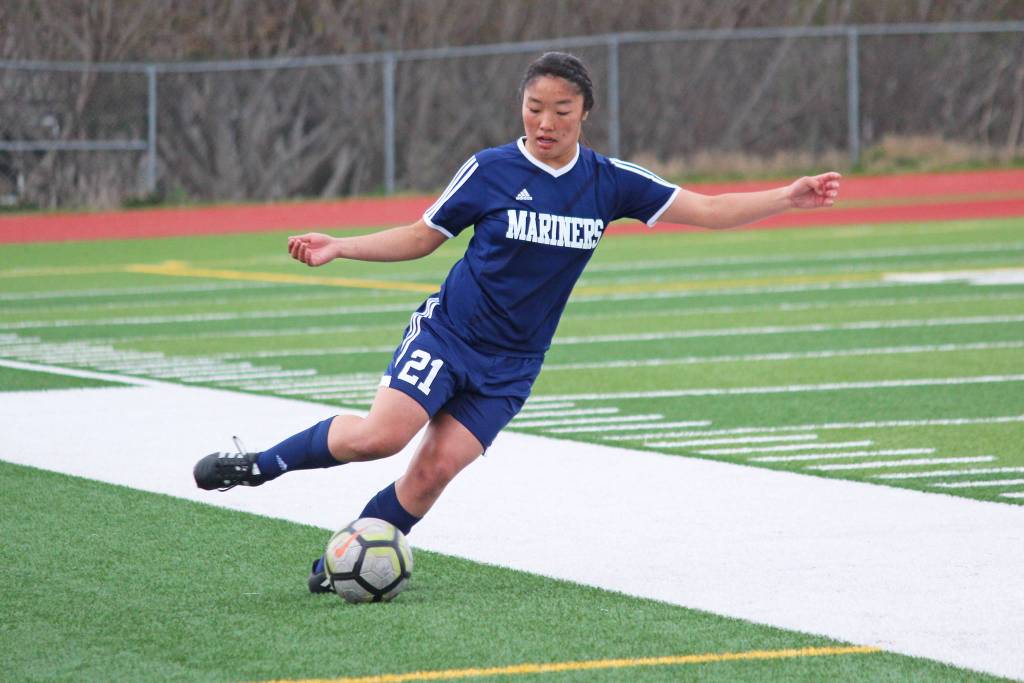 Homers Alyssum Veldstra sets up a pass during a Thursday, May 9, 2019 game against Kenai Central High School held at Homer High School in Homer, Alaska. (Photo by Megan Pacer/Homer News)