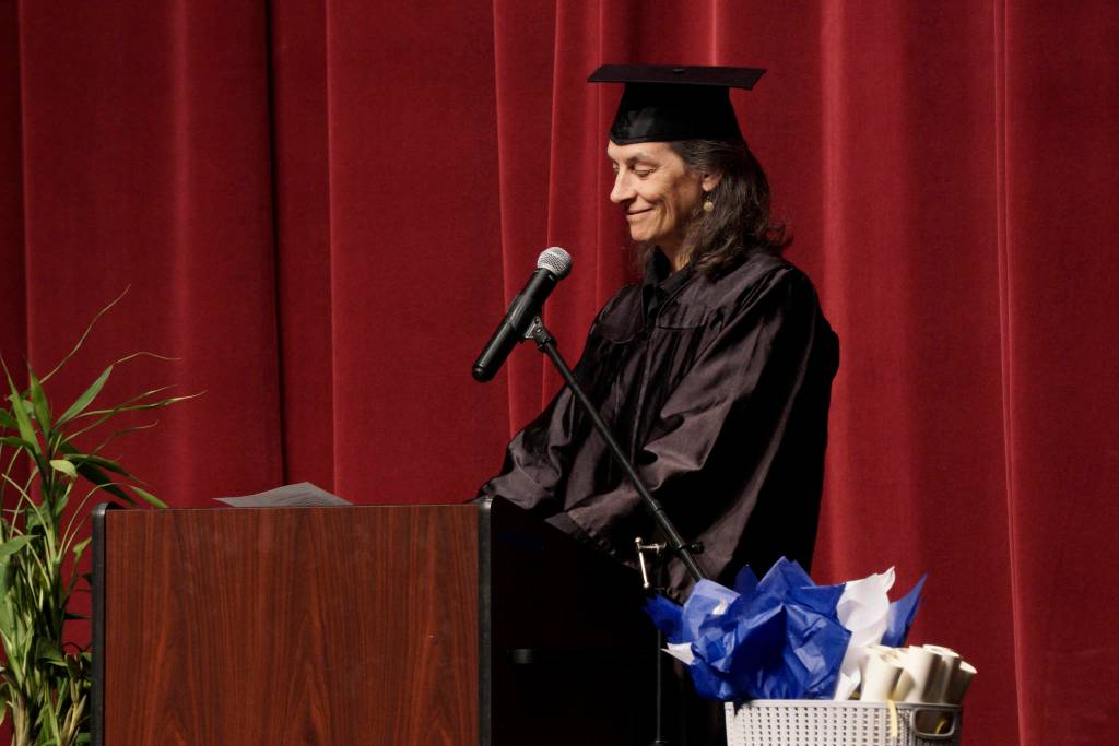 Catie Bursch delivers the keynote address at the Kachemak Bay Campus commencement last Wednesday, May 8, 2019, at the Mariner Theatre in Homer, Alaska. (Photo by Michael Armstrong/Homer News.)