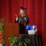 Valedictorian Abgail Ensign speaks at the Kachemak Bay Campus commencement last Wednesday, May 8, 2019, at the Mariner Theatre in Homer, Alaska. Ensign received an associate of arts degree from KBC. (Photo by Michael Armstrong/Homer News.)
