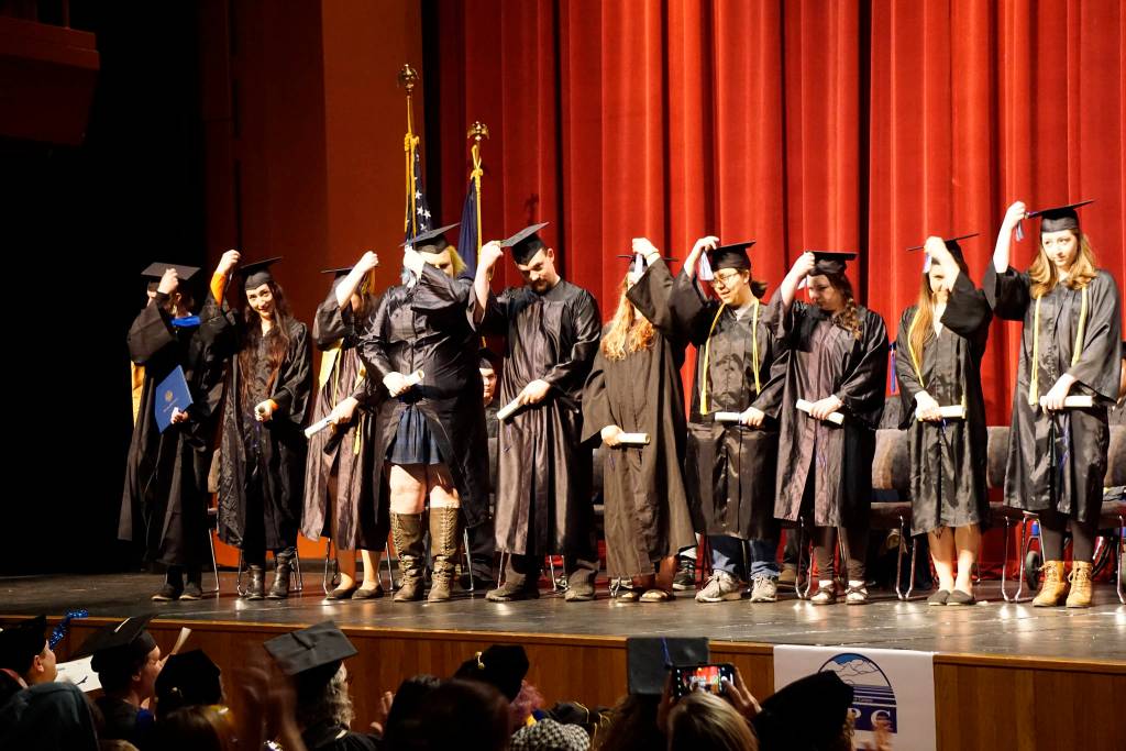 Graduates flip their tassels at the Kachemak Bay Campus commencement last Wednesday, May 8, 2019, at the Mariner Theatre in Homer, Alaska. (Photo by Michael Armstrong/Homer News.)