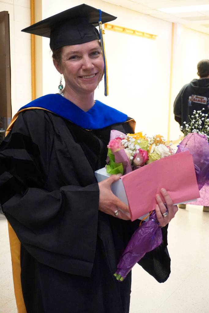 Emilie Springer smiles at a reception for the Kachemak Bay Campus commencement last Wednesday, May 8, 2019, at the Mariner Theatre in Homer, Alaska. A Homer resident from Ninilchik, Springer received a doctor of anthropology from the University of Alaska Fairbanks but chose to receive her PhD. in her home town  the first doctorate to do so at KBC commencement. (Photo by Michael Armstrong/Homer News.)