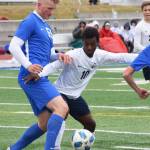 Soldotnas Hudson Metcalf (left) and Homers Eyoab Knapp battle for the ball Saturday, May 11, 2019, in a Peninsula Conference game in Soldotna, Alaska. (Photo by Joey Klecka/Peninsula Clarion)