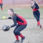 Kenai Central second baseman Leinani Rapoza, with shortstop Zaharah Wilshusen backing her up, prepares to throw out Homers Kaylin Anderson on Monday, May 13, 2019, at Steve Shearer Memorial Ball Park in Kenai, Alaska. (Photo by Jeff Helminiak/Peninsula Clarion)