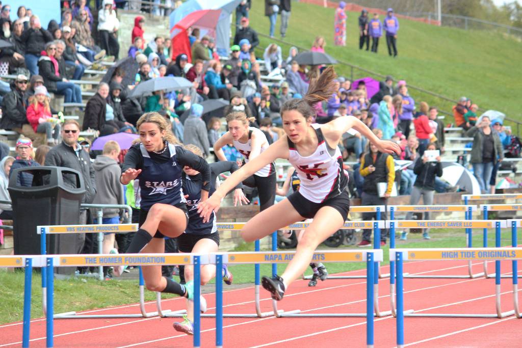 Kenais Savanna Wilson, right, and Soldotnas Holleigh Jaime (left) lead the girls 100-meter hurdles at the Saturday, May 11, 2019 Kenai Peninsula Borough track and field meet at Homer High School in Homer, Alaska. (Photo by Megan Pacer/Homer News)