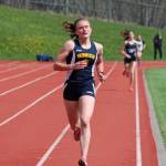 Homers Autumn Daigle approaches the finish line to take second place in the girls mile run ahead of Soldotnas Erika Arthur (background) on Saturday, May 11, 2019 at the Kenai Peninsula Borough track and field meet at Homer High School in Homer, Alaska. (Photo by Megan Pacer/Homer News)