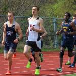 Soldotnas Jack Harris (left), Kenais Samuel Roberts (center) and Homers Adams Veldstra (right) lead the boys mile race during the Kenai Peninsula Boriugh track and field meet Saturday, May 11, 2019 at Homer High School in Homer, Alaska. (Photo by Megan Pacer/Homer News)