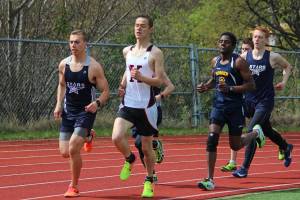 Soldotnas Jack Harris (left), Kenais Samuel Roberts (center) and Homers Adams Veldstra (right) lead the boys mile race during the Kenai Peninsula Boriugh track and field meet Saturday, May 11, 2019 at Homer High School in Homer, Alaska. (Photo by Megan Pacer/Homer News)