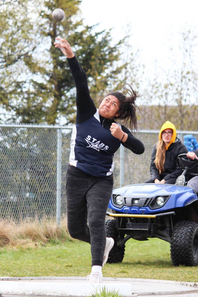 Soldotnas Ituau Tuisaula launches the shot put during the Saturday, May 11, 2019 Kenai Peninsula Borough track and field meet at Homer High School in Homer, Alaska. (Photo by Megan Pacer/Homer News)